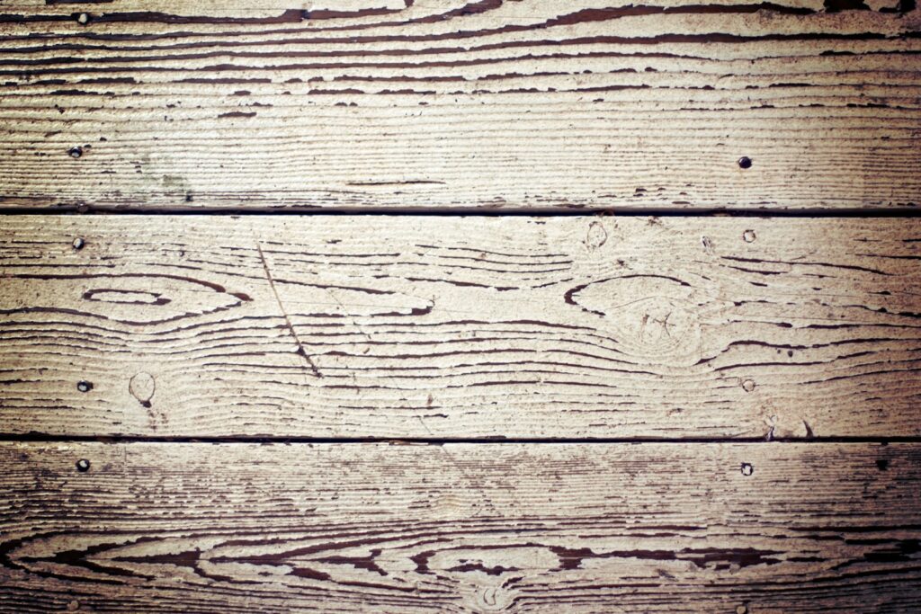 a close up of a wooden surface with knots