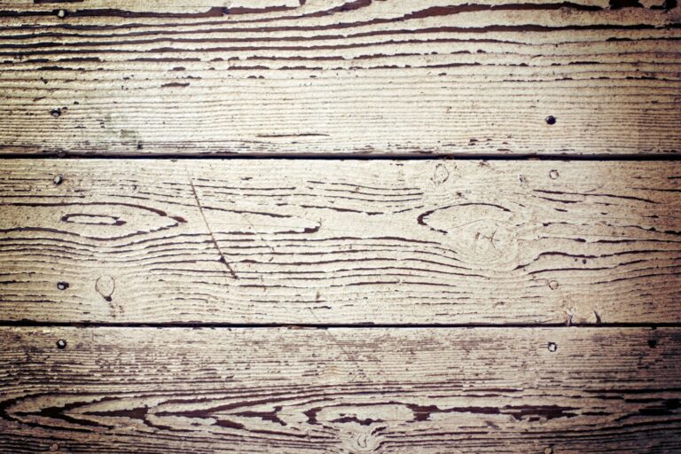 a close up of a wooden surface with knots