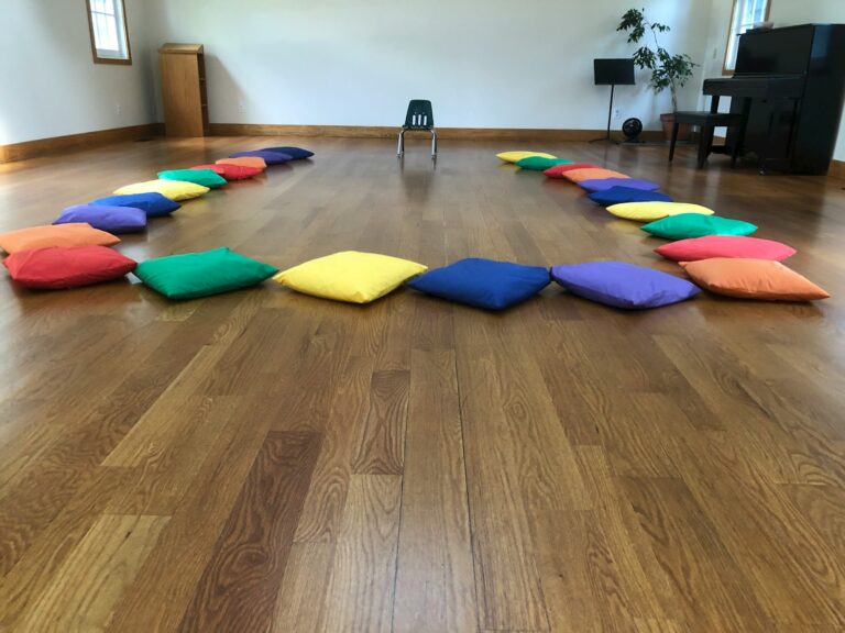 assorted-color throw pillows on the laminate floor