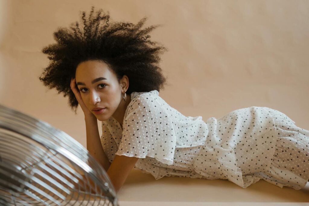 Woman in White and Black Polka Dot Dress
