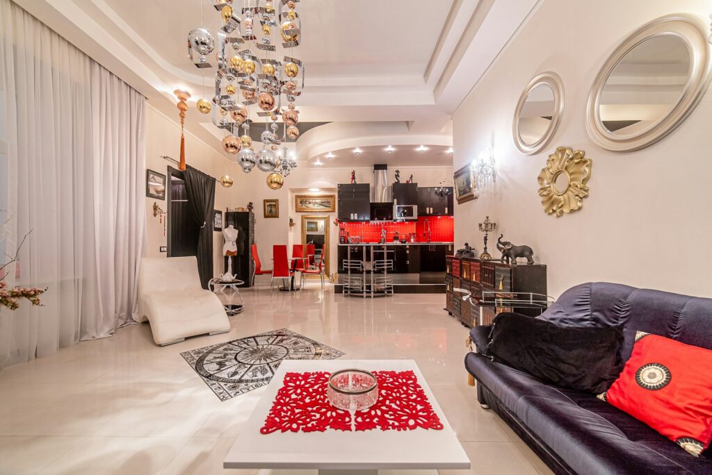 a living room filled with furniture and a chandelier